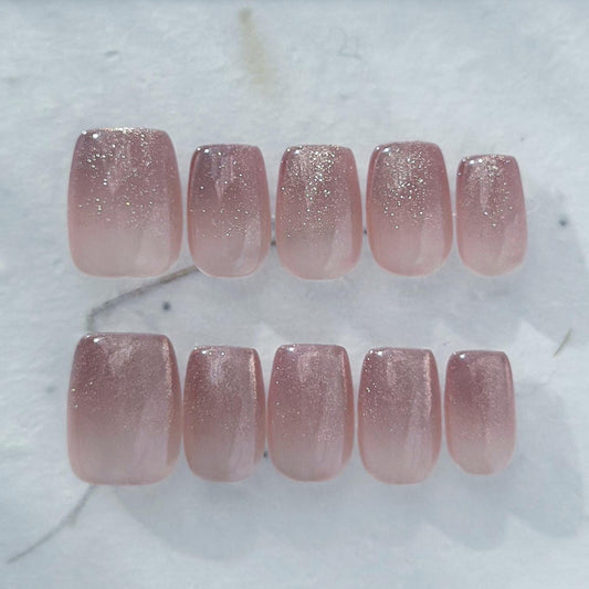 Short square pink mauve ombré press-on nails with fine glitter shimmer, soft blush gradient, and glossy finish